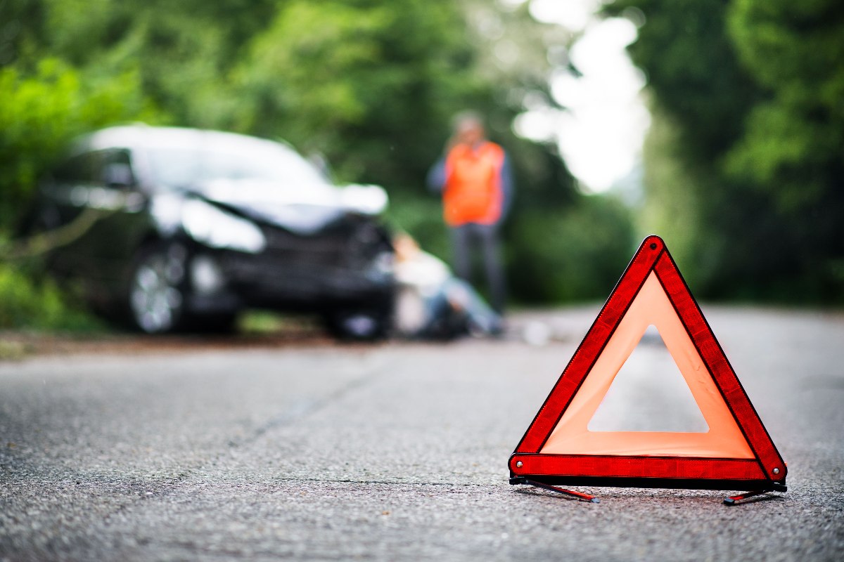 Close up of a red emergency triangle on the road